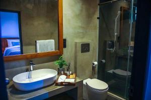 a bathroom with a sink and a toilet and a shower at The Heavens Villa - Colombo & BIA Airport in Ja-Ela +42 photos