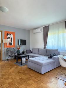 a living room with a couch and a table at Apartment Gabriela in Rakovica