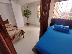 Ένα ή περισσότερα κρεβάτια σε δωμάτιο στο La Mejor Ubicación De La Ciudad