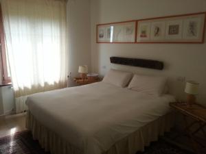 Postel nebo postele na pokoji v ubytování Alta Perugia B&B