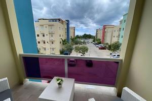 a balcony with a view of a parking lot at Sunshine Palmares de Caleta in La Romana