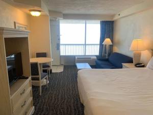 Katil atau katil-katil dalam bilik di Sea Swept Ocean Front Studio