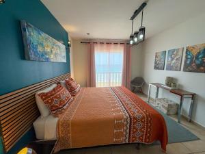 Postelja oz. postelje v sobi nastanitve Ocean View Palapa