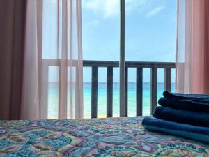 Postelja oz. postelje v sobi nastanitve Ocean View Palapa