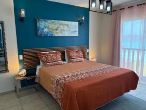 Postelja oz. postelje v sobi nastanitve Ocean View Palapa