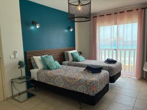 Postelja oz. postelje v sobi nastanitve Ocean View Palapa