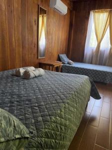 Ένα ή περισσότερα κρεβάτια σε δωμάτιο στο Cabaña Nacahome