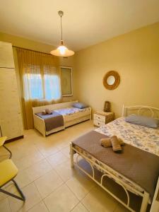 Ένα ή περισσότερα κρεβάτια σε δωμάτιο στο Seaside Villa Efi