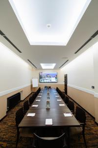 a large conference room with a long table and chairs at Wieniawa in Leszno