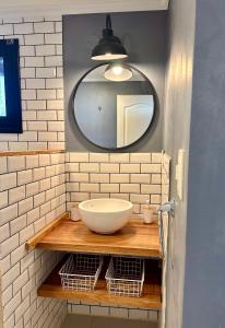 a bathroom with a sink and a mirror at Los Basaltos departamentos in Caviahue
