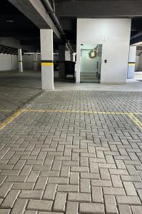 an empty parking lot with a door in a building at Loft da Jeane in Pomerode