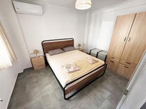 Postel nebo postele na pokoji v ubytování Thassos Forrest View Apartment