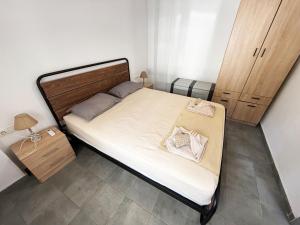 Postel nebo postele na pokoji v ubytování Thassos Forrest View Apartment