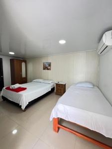 Cama o camas de una habitación en Tropical Dreams