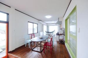 a dining room with a table and chairs at しまなみ宿Ebi in Imabari