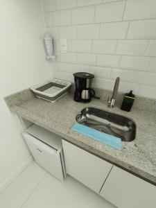 Køkken eller tekøkken på Kitnet Aconchego com sofisticação na Barra, Salvador, Bahia + 27 billeder