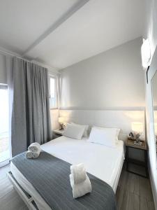 Katil atau katil-katil dalam bilik di AQUARAMA Rooms & Apartments