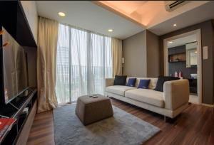 a living room with a couch and a large window at Luxury 22 Home 6Pax Old Klang Road Mid Valley KL Centre in Kuala Lumpur