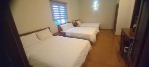 Postel nebo postele na pokoji v ubytování Dreams Hotel