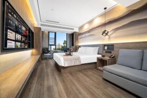 Predel za sedenje v nastanitvi Wenzhou Wuma Street Wenyuan Hotel is located in the heart of the city, easy to travel, free WiFi, breakfast, coffee, afternoon tea, free laundry service, recommended tourist attractions