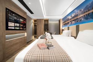 Postelja oz. postelje v sobi nastanitve Wenzhou Wuma Street Wenyuan Hotel is located in the heart of the city, easy to travel, free WiFi, breakfast, coffee, afternoon tea, free laundry service, recommended tourist attractions