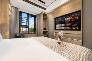 Postelja oz. postelje v sobi nastanitve Wenzhou Wuma Street Wenyuan Hotel is located in the heart of the city, easy to travel, free WiFi, breakfast, coffee, afternoon tea, free laundry service, recommended tourist attractions