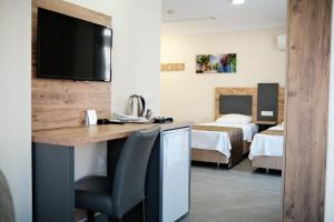 Giường trong phòng chung tại Club Efes Otel