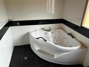 a large white bath tub in a bathroom at Cabaña el Mirador de Polo de Villa de Leyva in Villa de Leyva