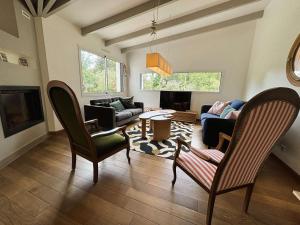 a living room with chairs and a couch at Maison charmante, proche plages de l'Ile-Tudy, calme garanti - FR-1-481-180 in Combrit