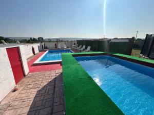 two swimming pools on top of a building at Neiras Apartments Blagaj in Blagaj