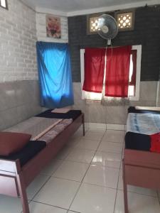 Ένα ή περισσότερα κρεβάτια σε δωμάτιο στο Apollo Hostel