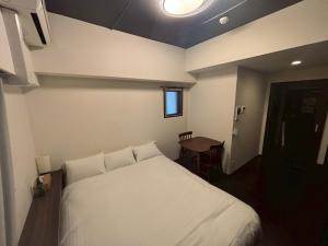Star Residence2 春吉中洲にあるベッド