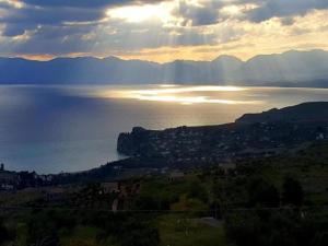 a view of a body of water with the sun setting at Holiday Home in Carlentini with Swimming Pool,Garden,Terrace in Agnone Bagni