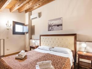 a bedroom with a large bed in a room at Holiday Home in Carlentini with Swimming Pool,Garden,Terrace in Agnone Bagni