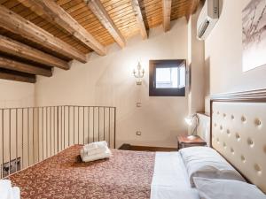 a bedroom with a large bed in a room at Holiday Home in Carlentini with Swimming Pool,Garden,Terrace in Agnone Bagni