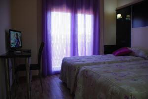 Ein Bett oder Betten in einem Zimmer der Unterkunft Casa Rural Virgen de las Cruces