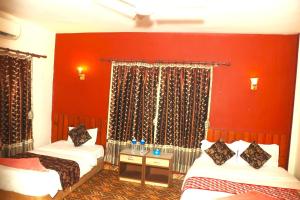 Katil atau katil-katil dalam bilik di Hotel Surya Adventure