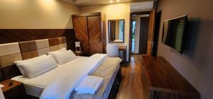 Ένα ή περισσότερα κρεβάτια σε δωμάτιο στο Dreamland Oasis Аpart