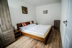Postel nebo postele na pokoji v ubytování Dueta Apartment