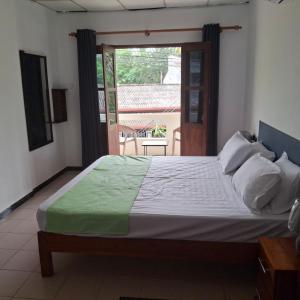 Ένα ή περισσότερα κρεβάτια σε δωμάτιο στο Sandy Steps