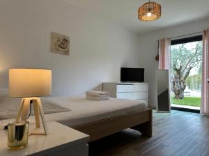Posteľ alebo postele v izbe v ubytovaní La Villa aux bambous + 37 fotografií