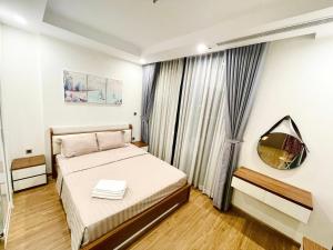 a bedroom with a bed and a window at Delux Studio In Vinhomes Green Bay Near WJ Marriott Hotel in Hanoi +73 photos
