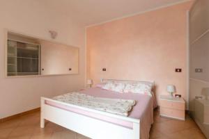 Łóżko lub łóżka w pokoju w obiekcie Casa Angela