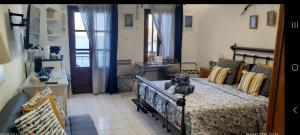 a bedroom with a bed with a stuffed animal on it at The Island sea view apartment in Elounda