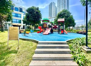 a park with a playground with a slide at Delux Studio In Vinhomes Green Bay Near WJ Marriott Hotel in Hanoi