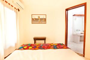 Postel nebo postele na pokoji v ubytování Casa Iguana Holbox - Beachfront Hotel