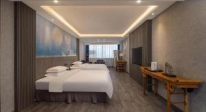 Postel nebo postele na pokoji v ubytování Xi'an Huiya Tianmu Hotel