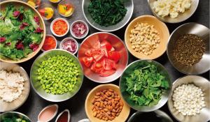 a bunch of bowls filled with different types of food at ANA Holiday Inn Kanazawa Sky by IHG in Kanazawa