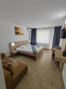 Postel nebo postele na pokoji v ubytování Hotel Gloria