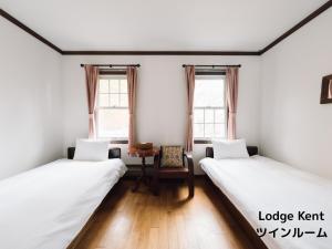 Postel nebo postele na pokoji v ubytování Lodge Kent & Cottage Kent